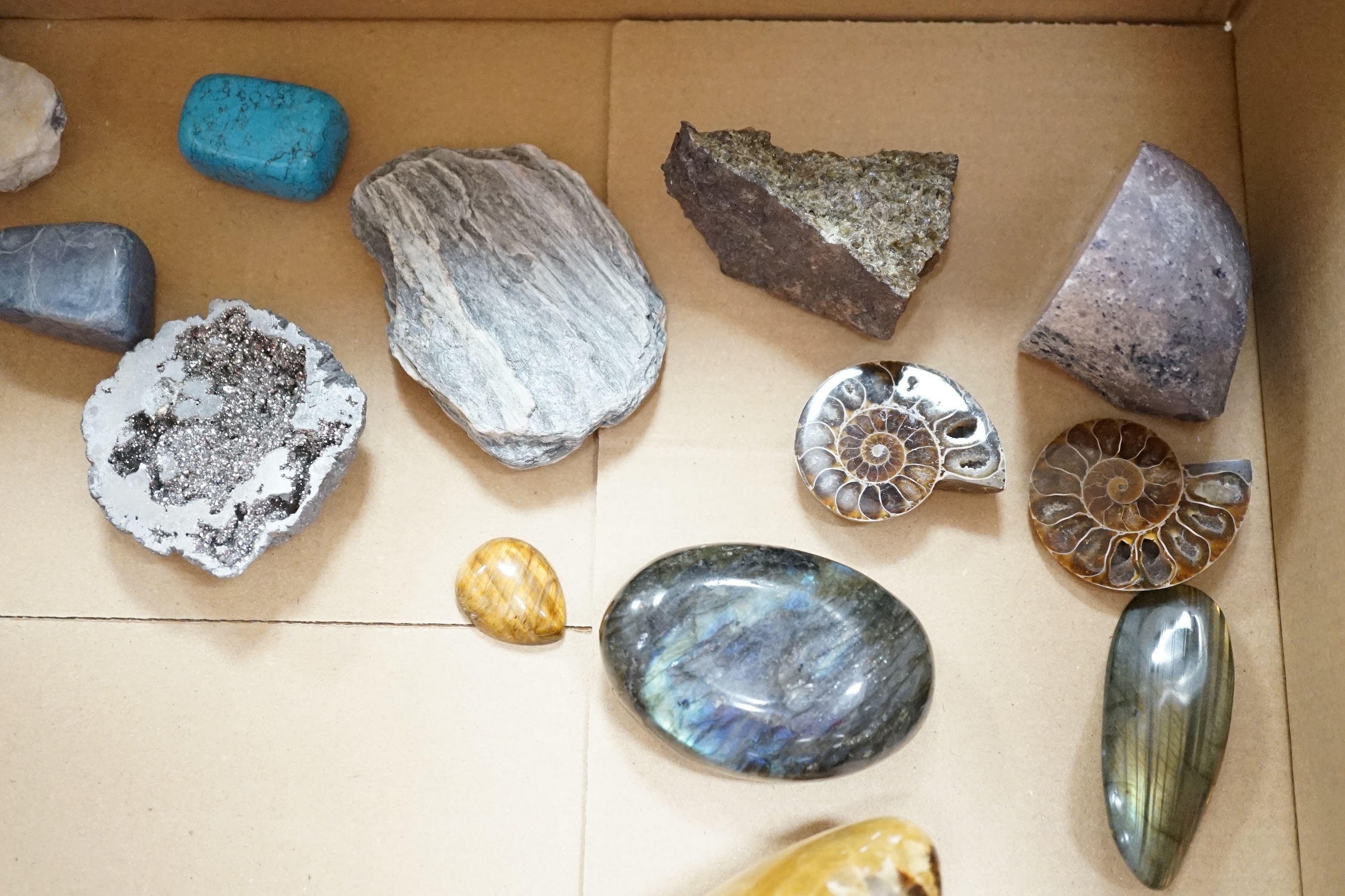A collection of mineral specimens and geodes to include Amethyst, rose quartz, tigers eye, labradorite and polished fossils
